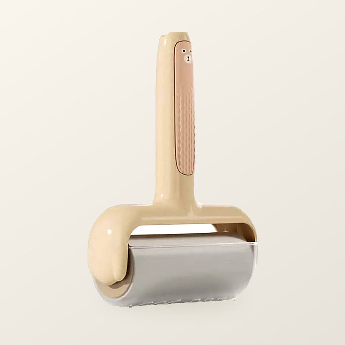 Wide sticky lint roller with a cream bear-shaped handle and a ten centimetre drum, on a warm cream background